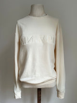 a comfy easy to wear sweatshirt in cream ivory with 'vintage' embroidered upside down for an abstract look