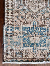 a vintage heriz runner with blue and taupe hues