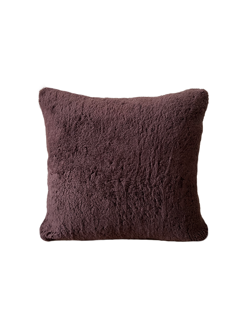 a square shearling pillow in chocolate brown shearling