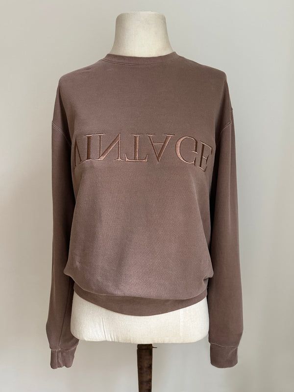 a comfy easy to wear sweatshirt in faded mink brown with 'vintage' embroidered upside down for an abstract look
