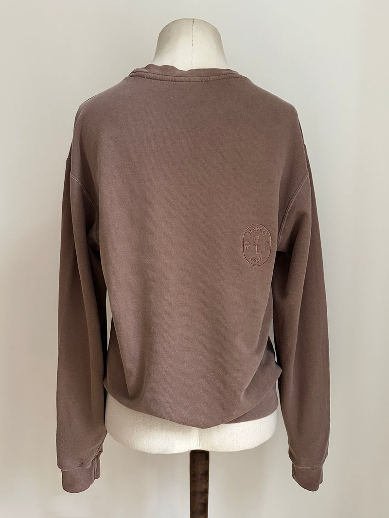 a comfy easy to wear sweatshirt in faded mink brown with 'vintage' embroidered upside down for an abstract look