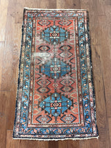 an antique hamadan malayer rug with a coral field and blue medallions