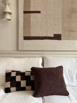 a square shearling pillow in chocolate brown shearling