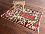 a small turkish milas rug with a salmon pink field and thick ivory border
