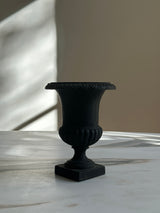 an antique victorian cast iron urn planter in neo-classical style