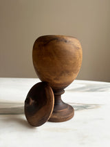 a beautiful antique carved wooden chalice with lid