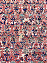 an antique malayer rug with a pretty paisley pattern on a coral field