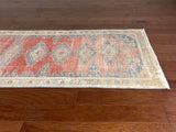 a vintage mahal vis runner with pink, coral and blue tones