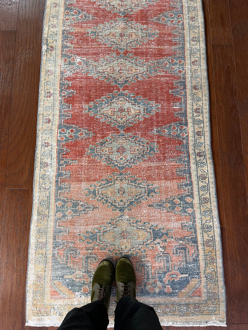 a vintage mahal vis runner with pink, coral and blue tones