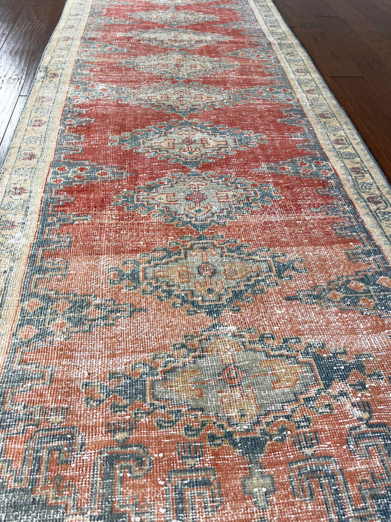 a vintage mahal vis runner with pink, coral and blue tones