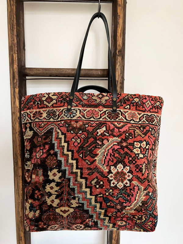a tote bag made with antique mahal rug and camel suede