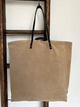 a tote bag made with antique mahal rug and camel suede