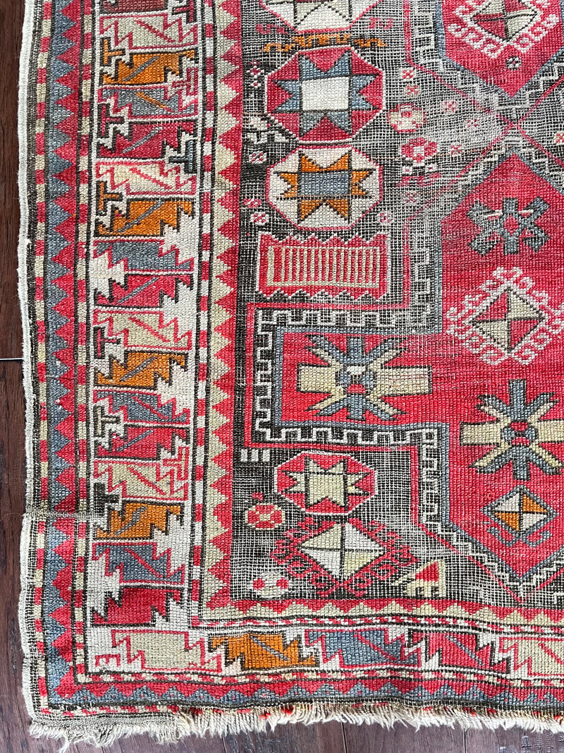 a medium-size caucasian shirwan rug with hot pink accents