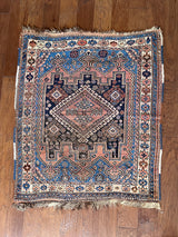 A mini vintage Afshar rug with blue and dusty pink details