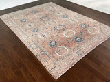 a large heriz rug with soft coral and powder blue tones