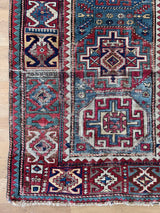 Jackson: a Caucasian Shirwan with blue and red tones and a geometric pattern