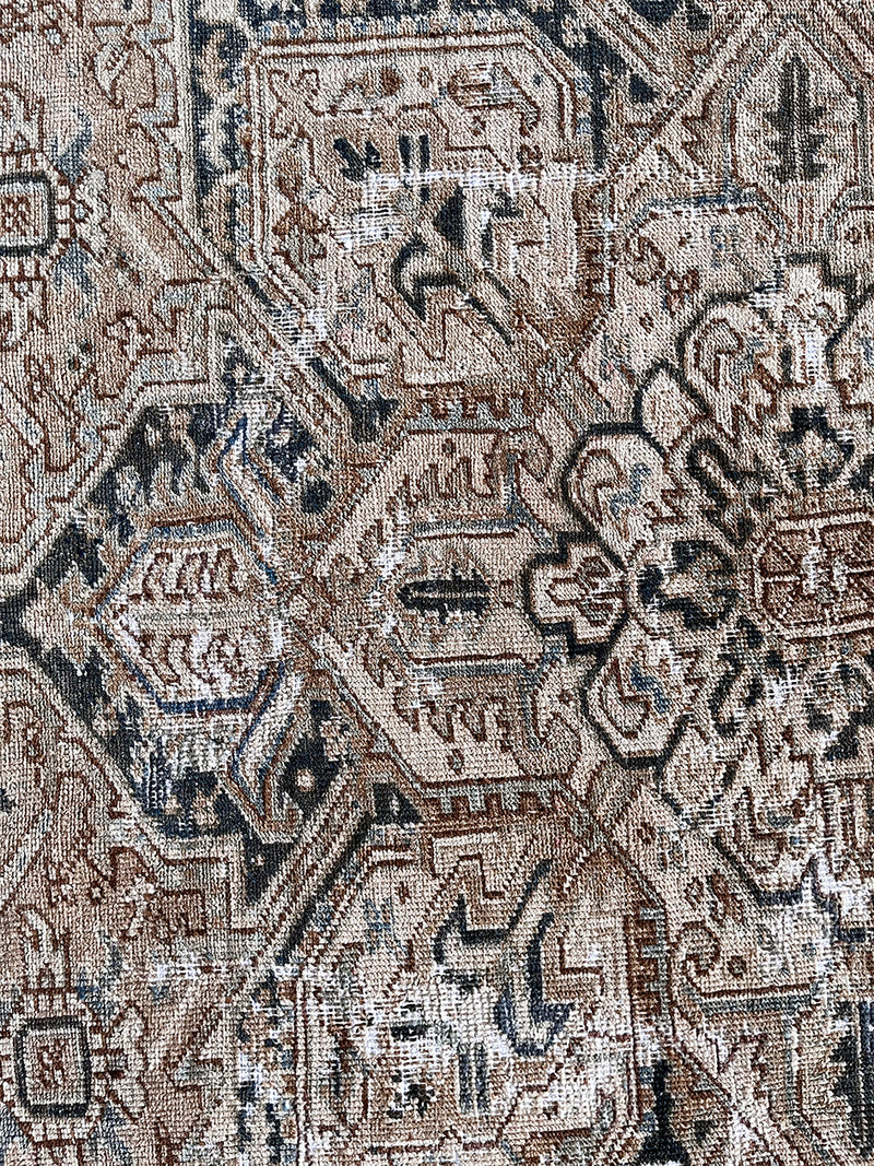 A large antique Heriz rug neutral palette and dark brown medallion. 